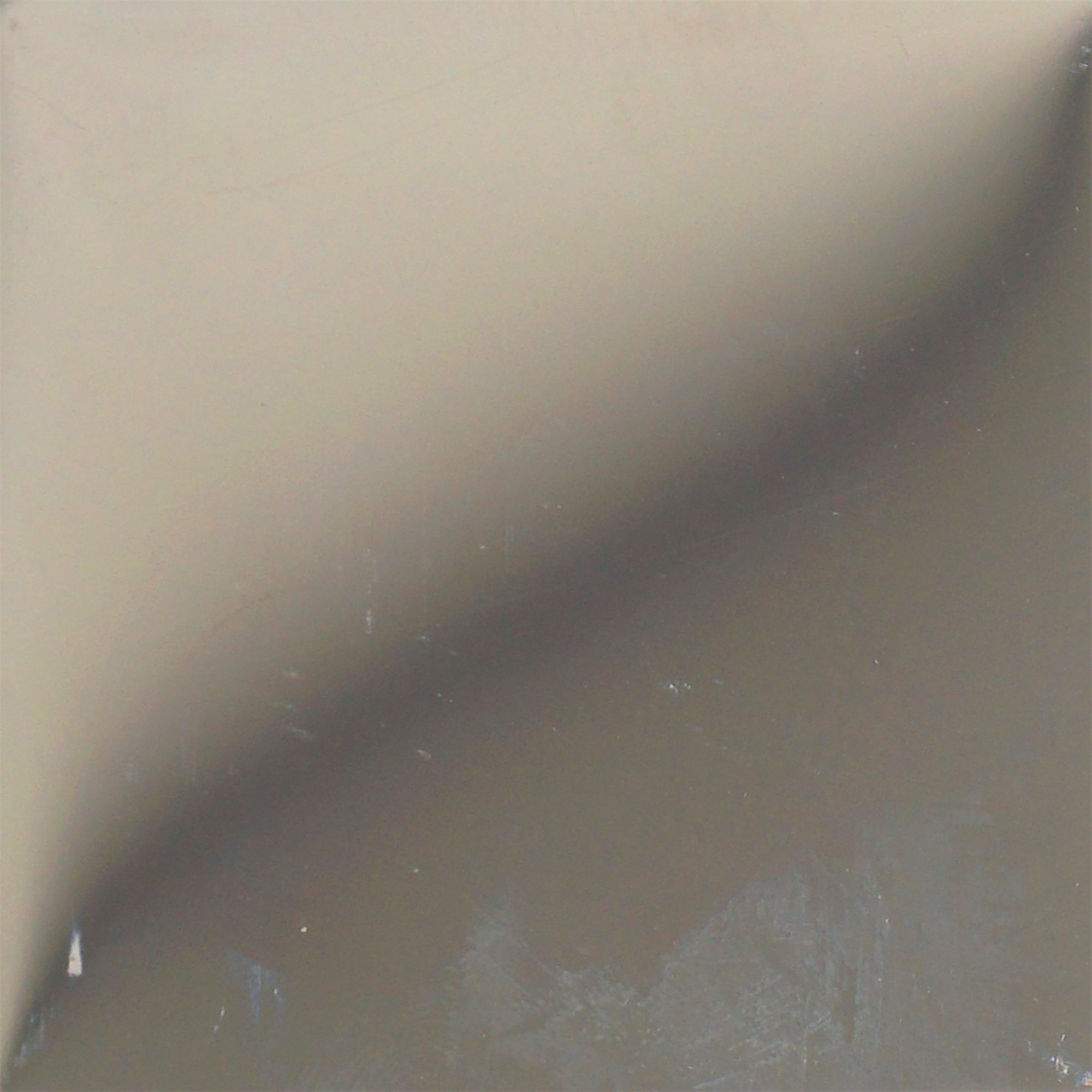 Mirror polished stainless steel returning a sharp reflected image