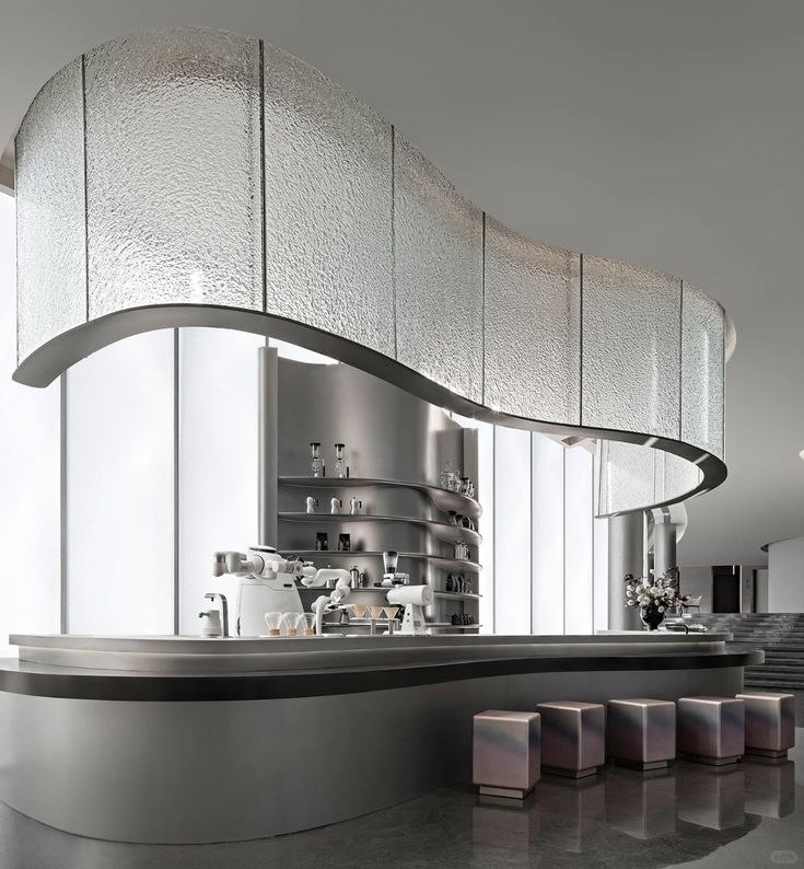 Mirror-polished sculptural stainless steel form reflecting its architectural surroundings