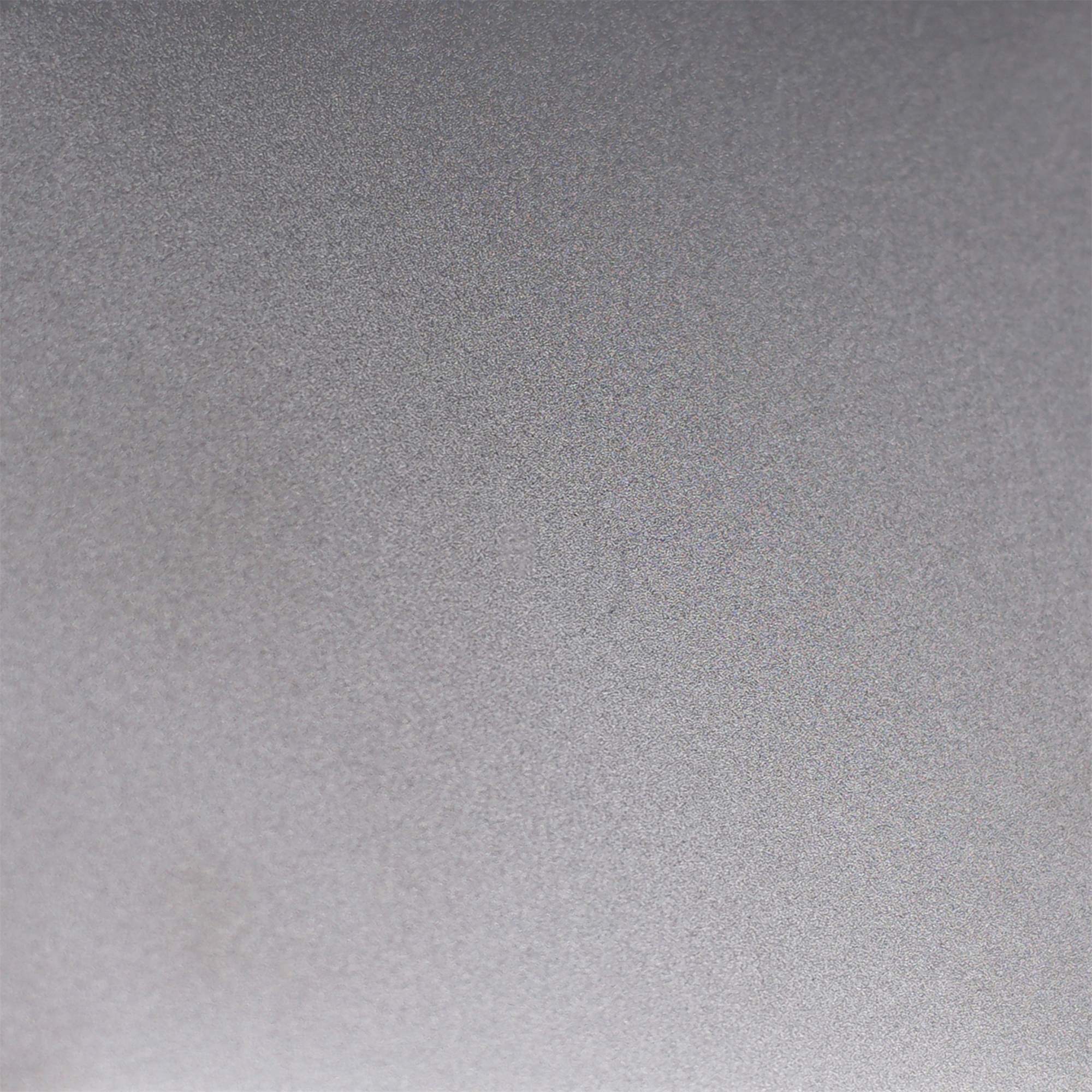 Macro view of a bead-blasted stainless steel surface showing its fine non-directional texture
