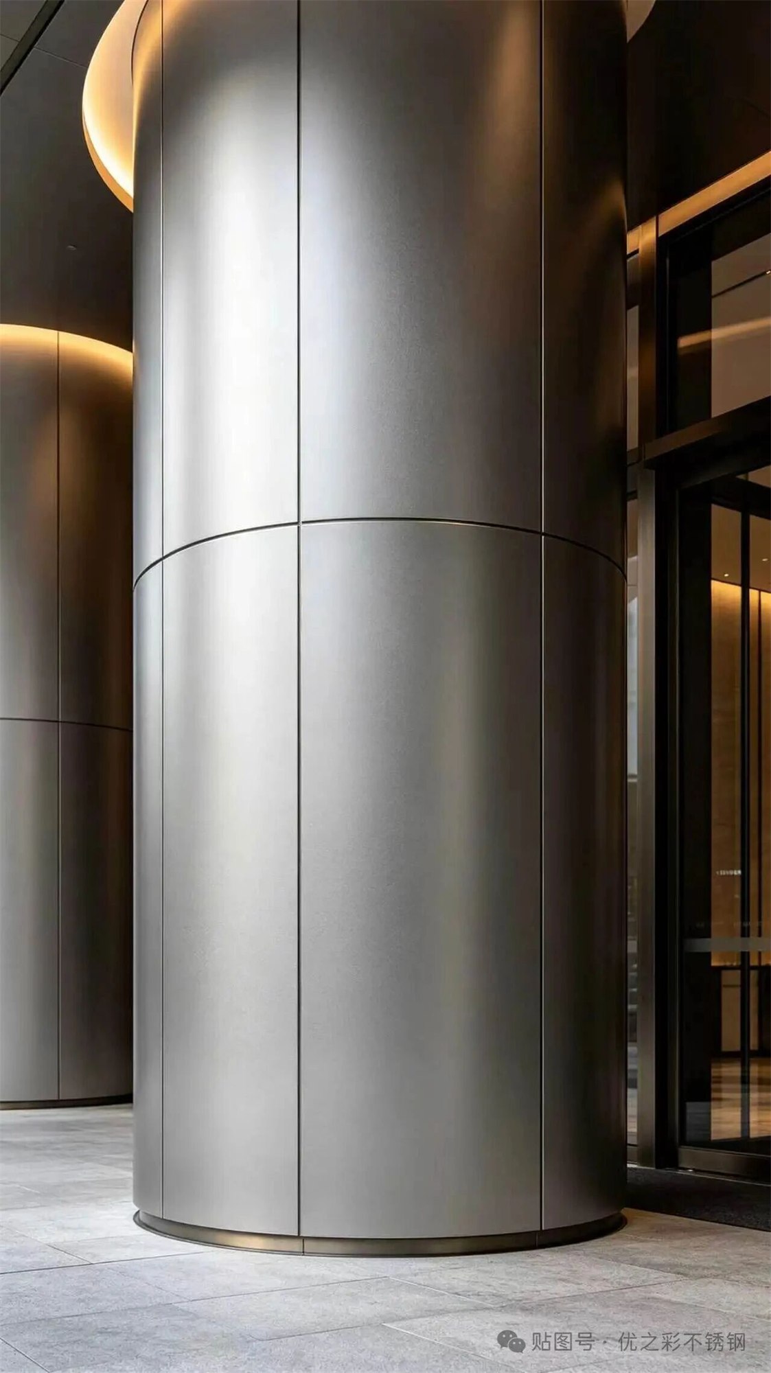 Entrance portal in a uniform matte metal finish with a restrained metallic presence