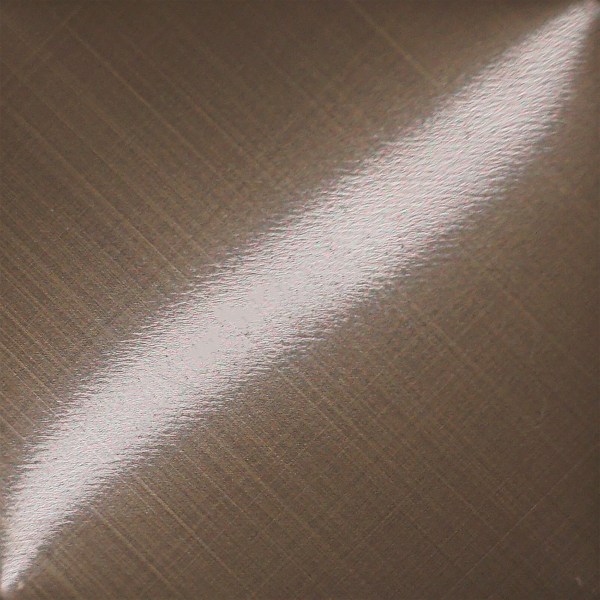 Champagne gold stainless steel with a cross brushed grain that gives the colour a controlled linear character