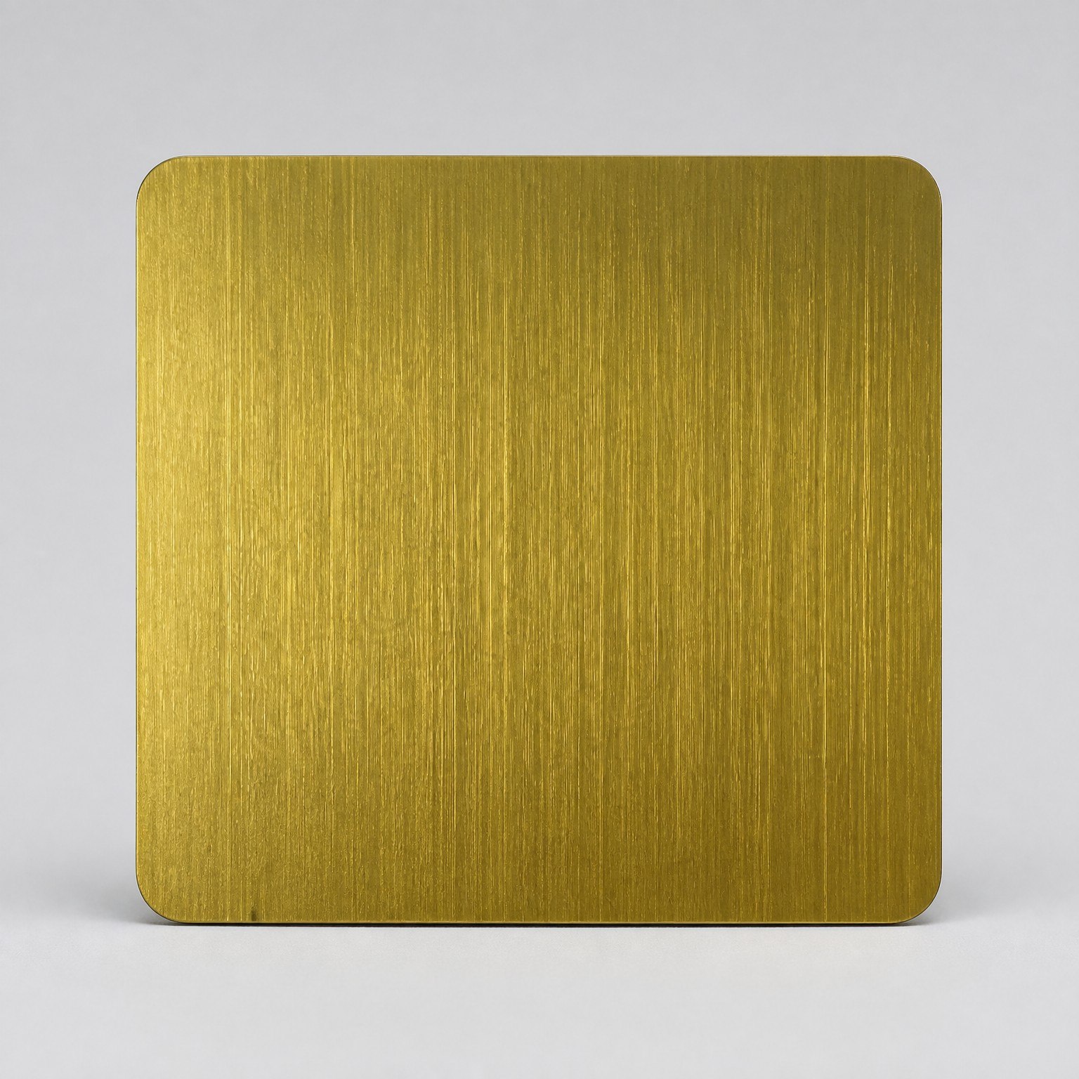 Gold PVD color reference on a brushed stainless steel sample
