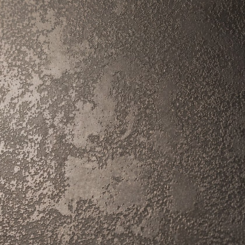A mottled platinum-brown antique patina stainless steel surface