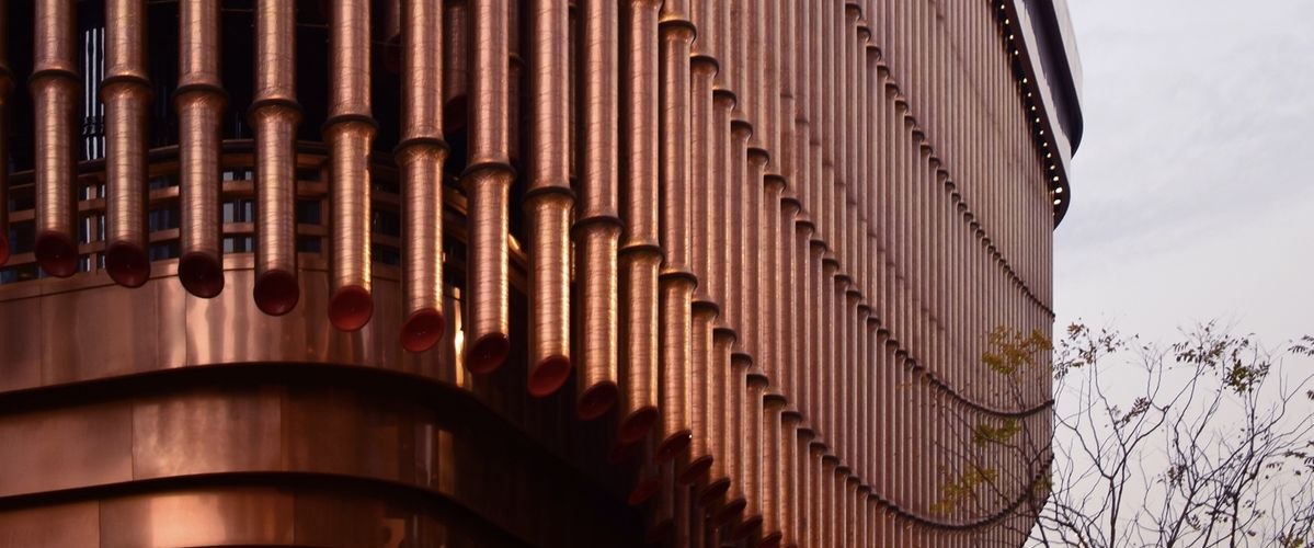A warm bronze metal facade detail