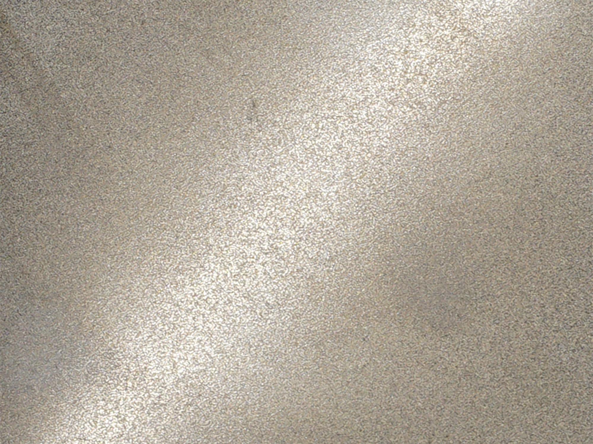 A bead blasted stainless steel surface with a soft matte finish