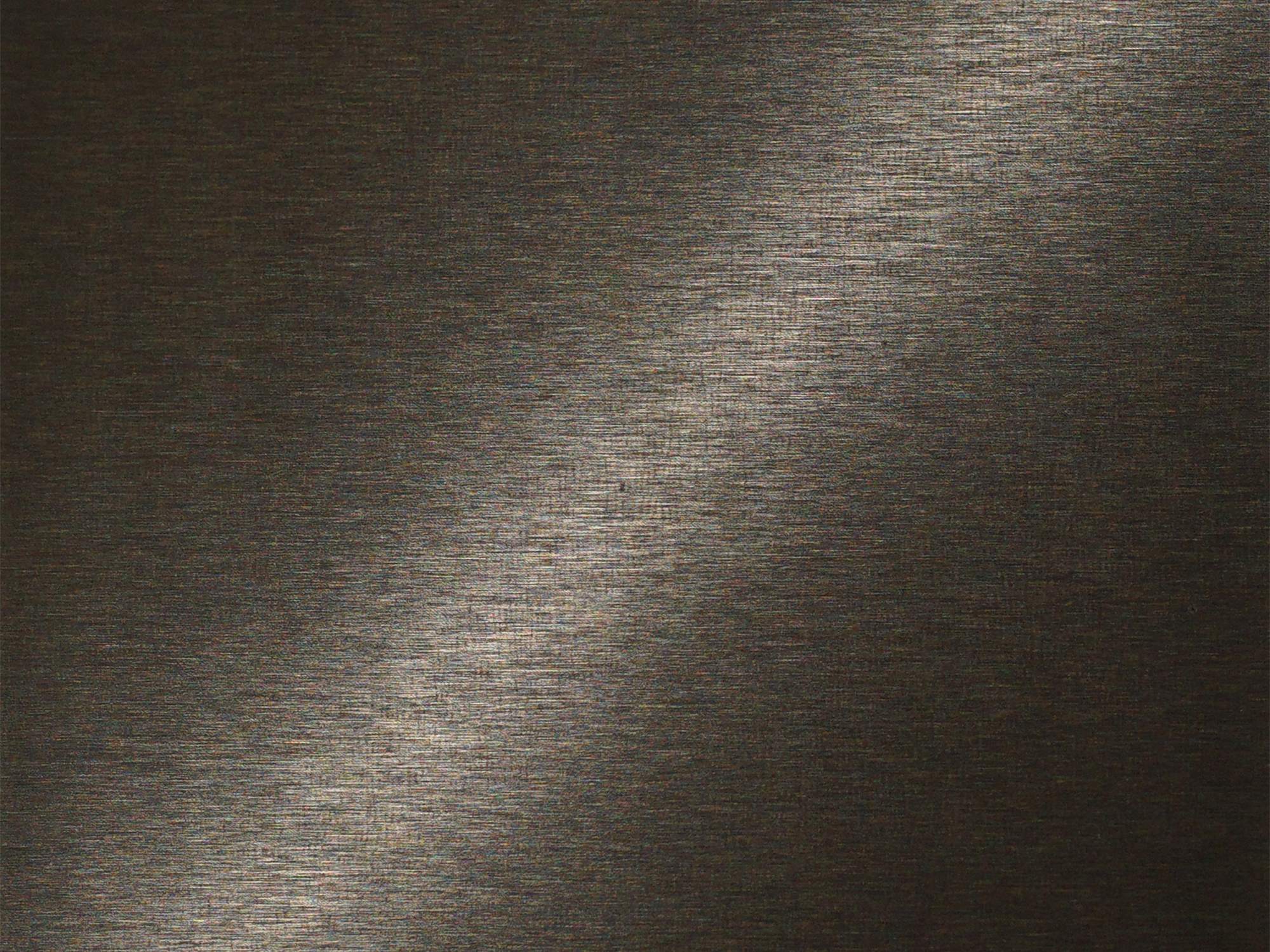 A dark titanium colour coated stainless steel surface