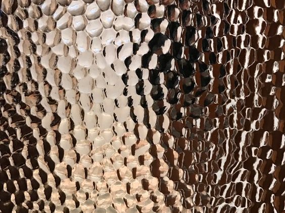Bronze hammered stainless steel with a deep architectural metallic tone