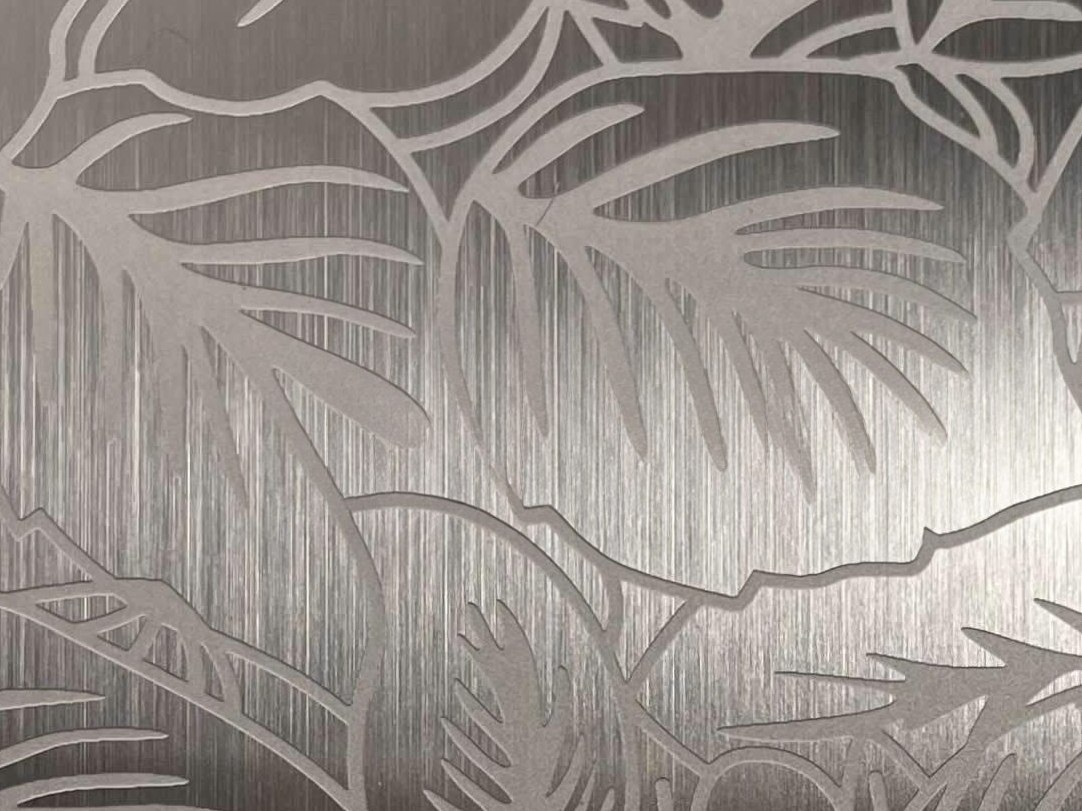 Etched stainless steel with flowing organic forms creating a softer and more expressive pattern