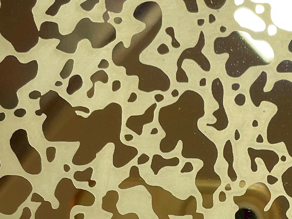 Etched stainless steel developed from project artwork into a custom graphic pattern