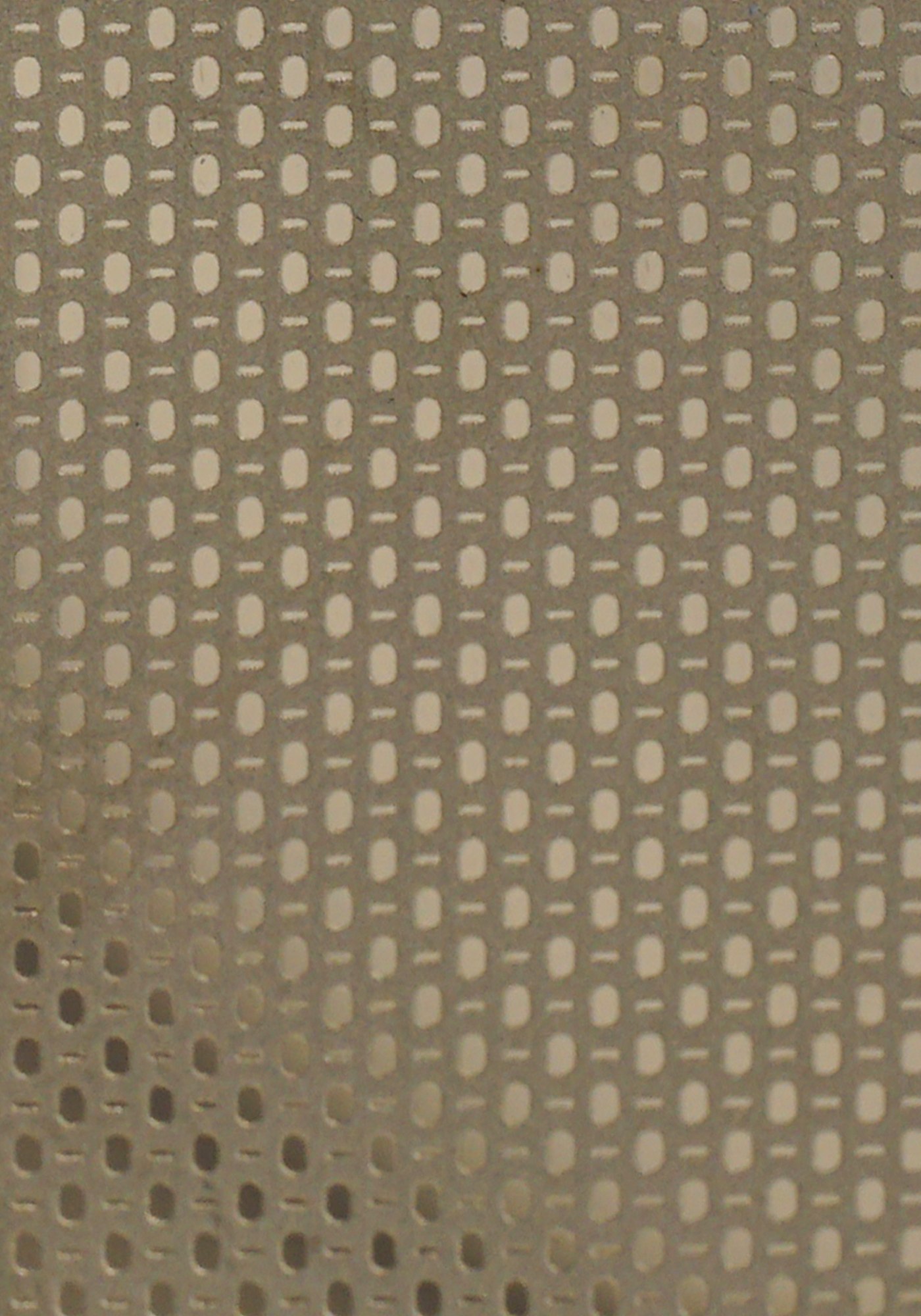 A platinum etched stainless steel surface where the pattern is defined by fine tonal contrast