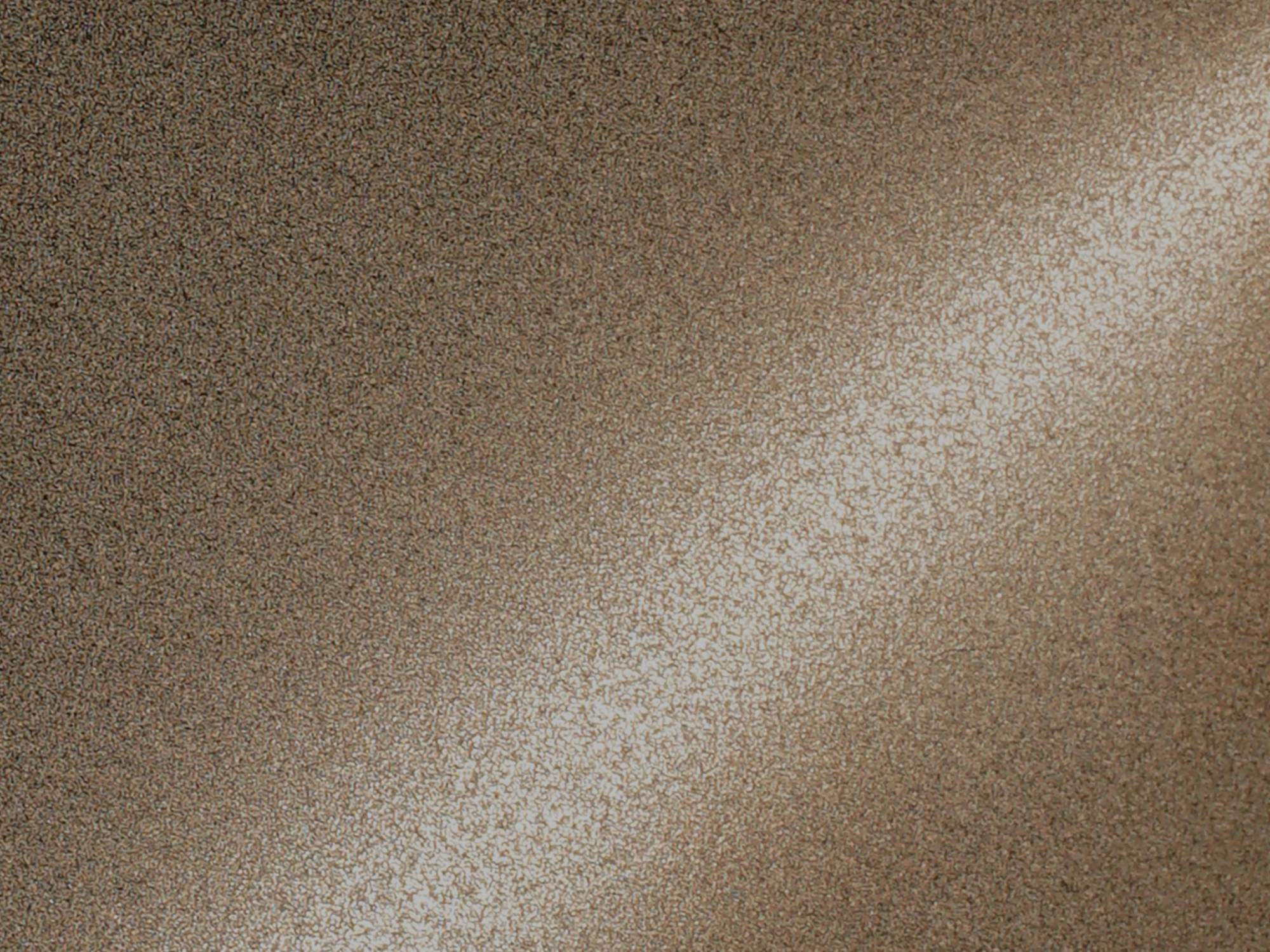 A champagne PVD colour coated stainless steel surface with a bead blasted base