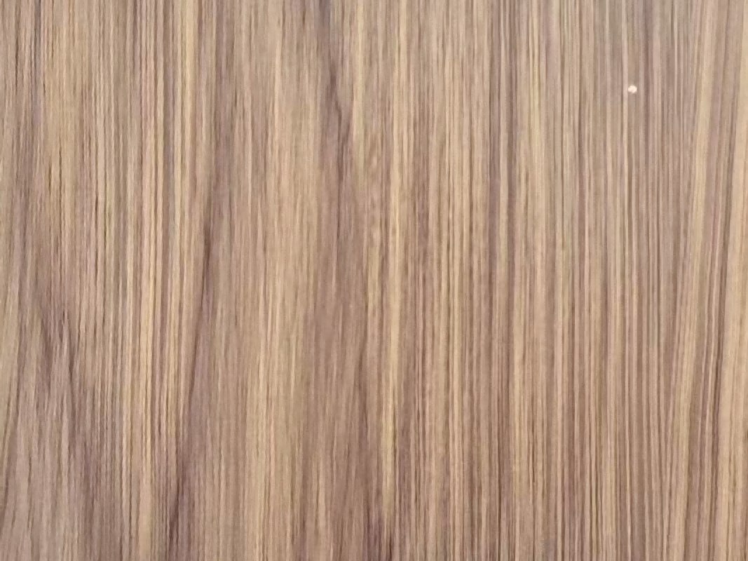 A printed and transferred wood grain effect applied to a stainless steel surface