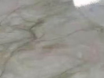 A close detail of the marble-effect print in a printed stainless steel sheet