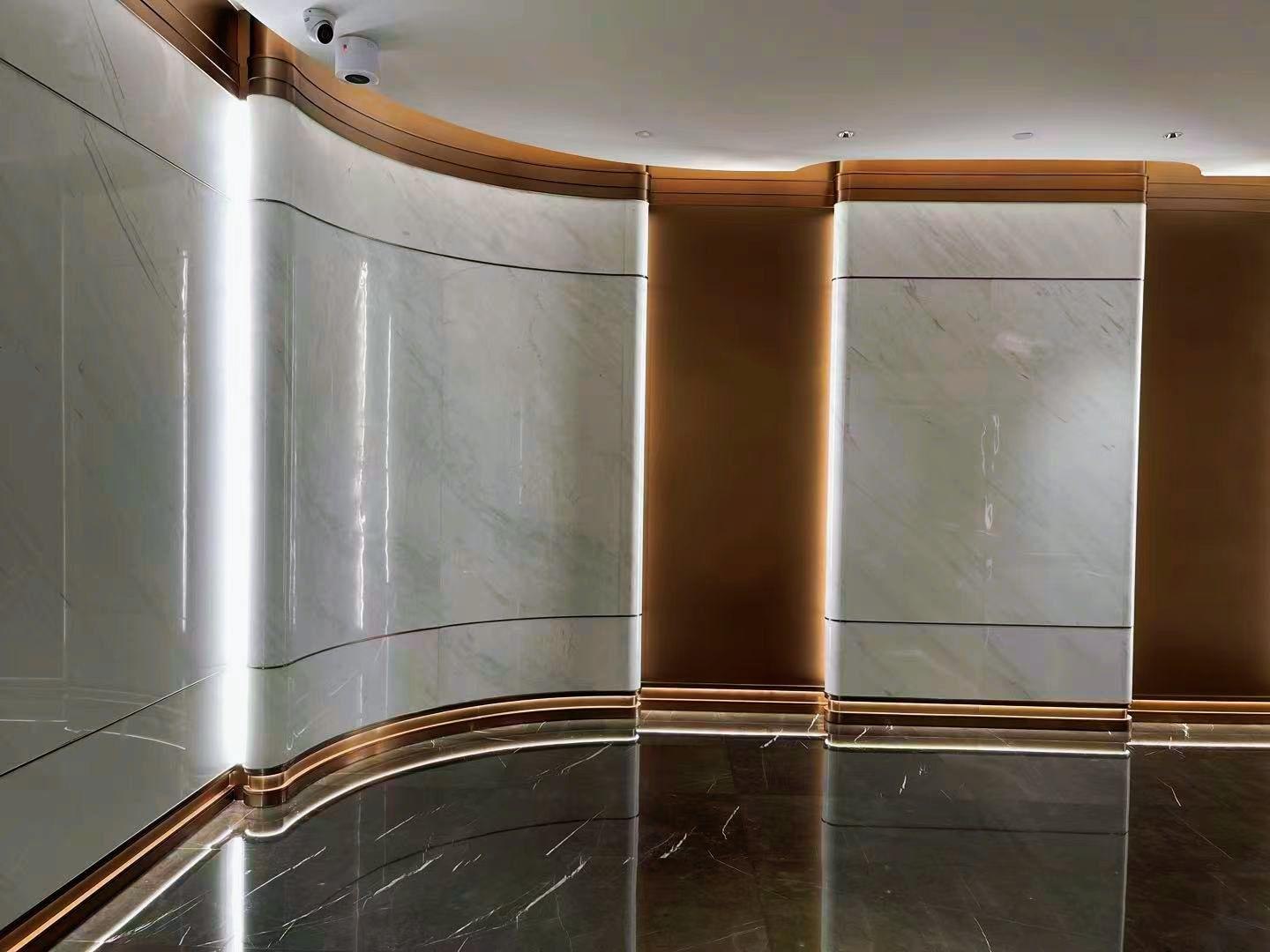 The same printed stainless steel surface carried across adjoining panels in a finished installation