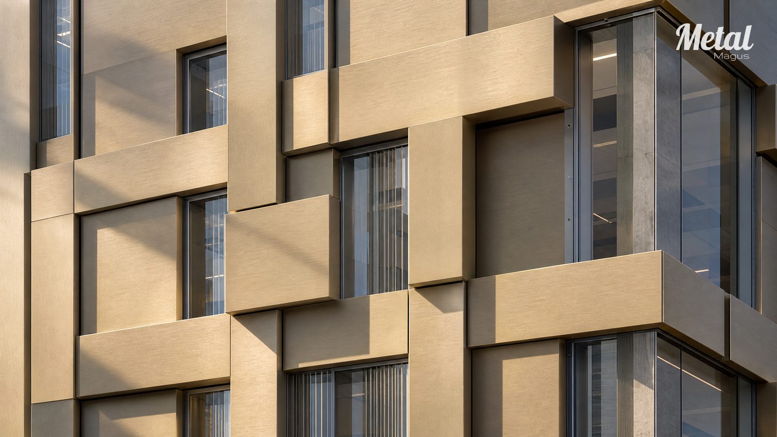 Close view of the flat and convex warm sand-gold PVD stainless steel modules