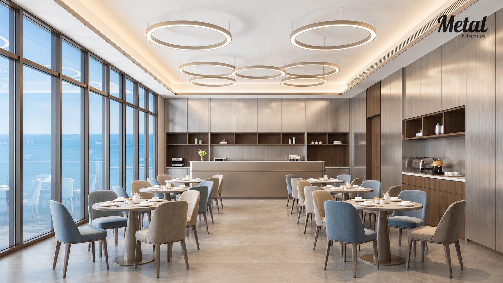 Hotel breakfast area with warm lighting and brushed metal finishes