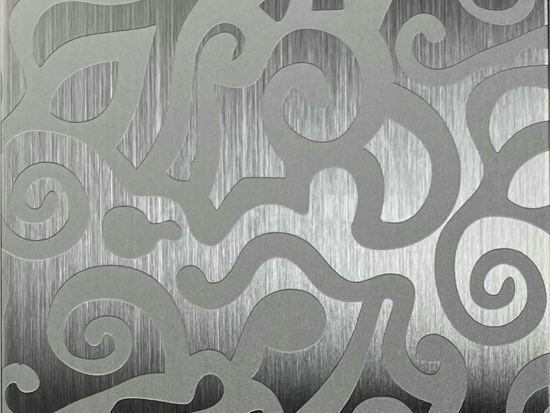 An etched stainless steel sample where the pattern is etched into the metal surface for a matte contrast