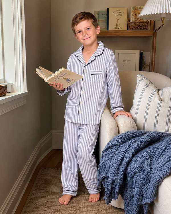 Kids' striped cotton pajama detail showing notched collar, piping, chest pocket and woven cotton fabric