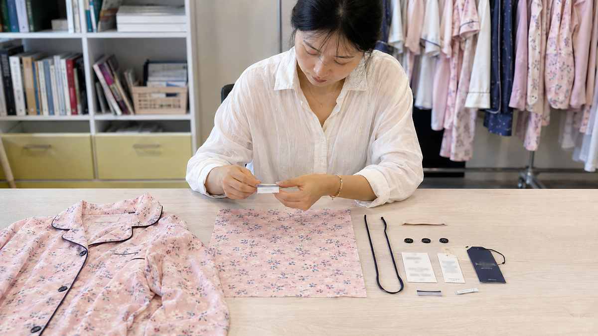 Custom pajama print labels piping buttons and trims reviewed before sample production