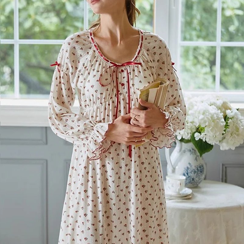 Ribbon trim front tie neckline and ruffle cuff detail on a cottagecore floral cotton nightgown