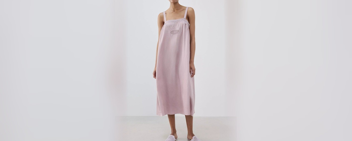 Pink cotton slip nightgown with an embroidered lace yoke and slim adjustable straps for private label sleepwear