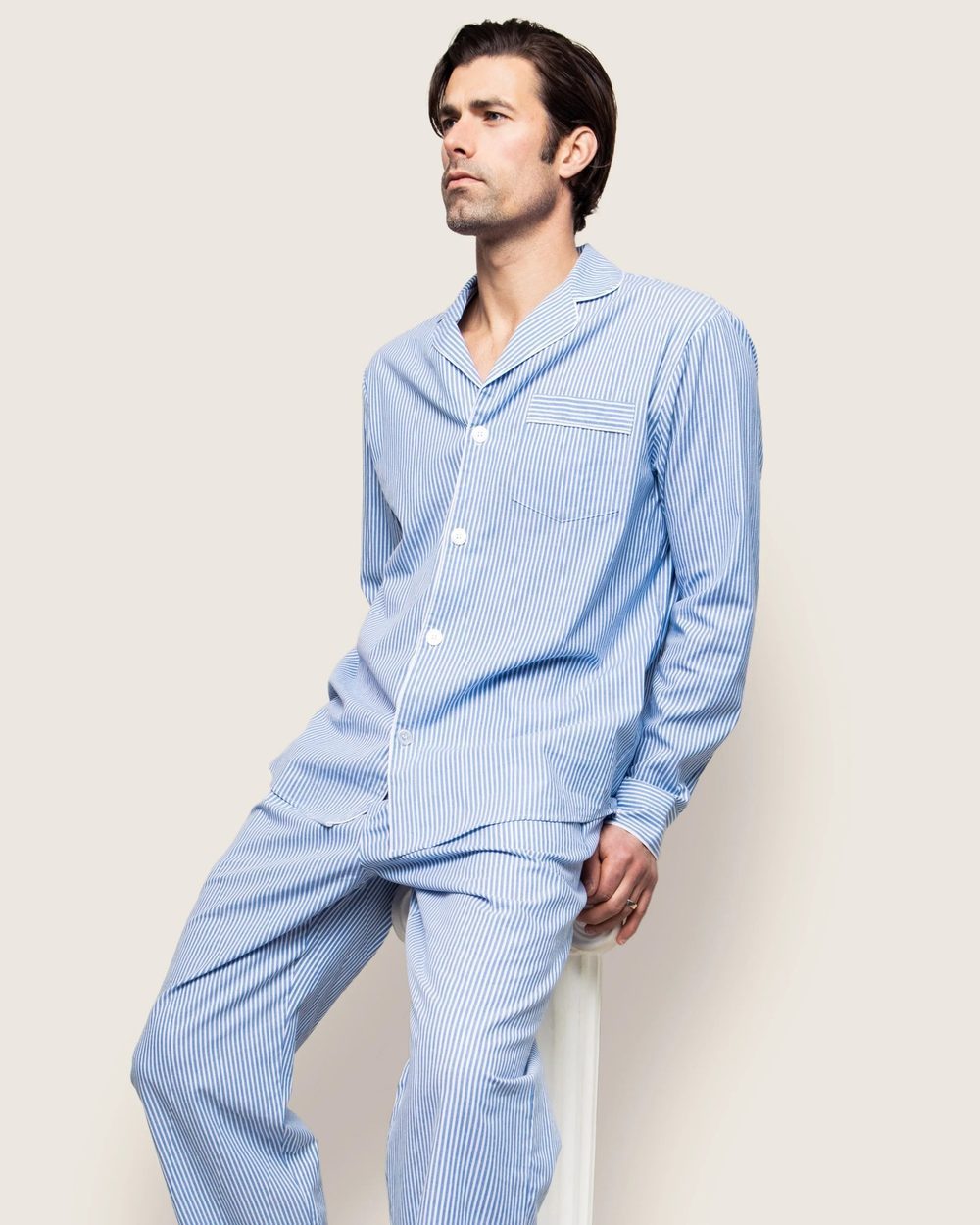 Classic two-piece pajama set with a striped button-up top and matching long pants