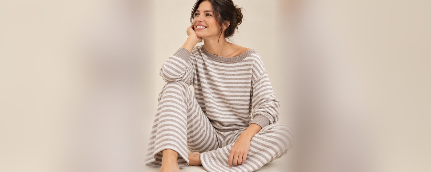 Grey and white striped off-shoulder knit lounge set with a long sleeve top and wide-leg pants for private label knit loungewear