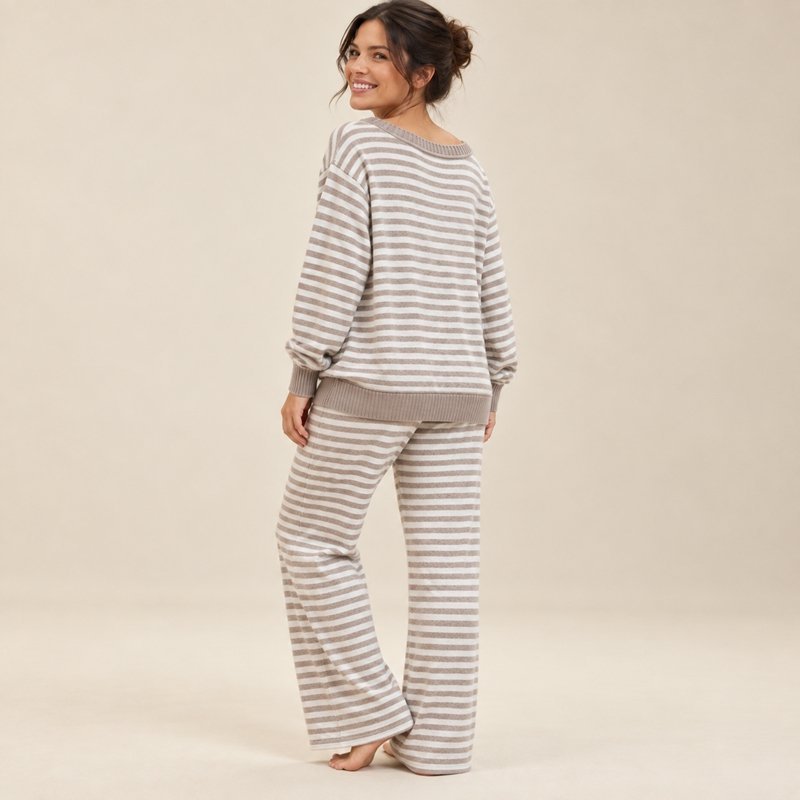 Close view of the yarn-dyed breton stripe and wide-leg pants on a grey and white off-shoulder knit lounge set