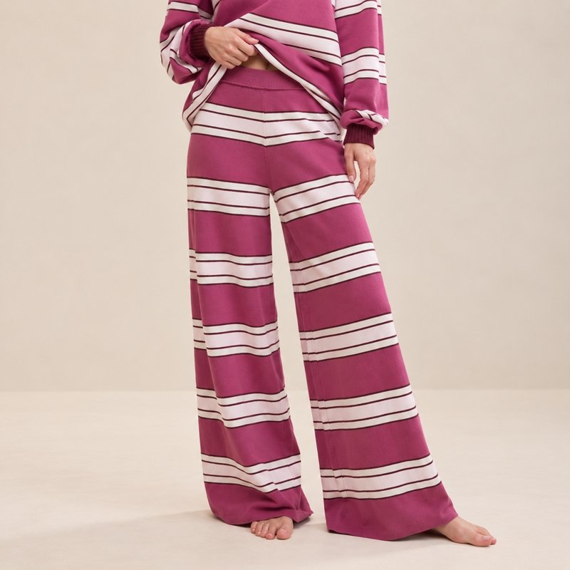 Close view of the wide block stripe and wide-leg pants on a berry off-shoulder knit lounge set