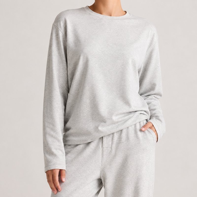 Close view of the brushed napped surface and wide-leg pants on a light grey knit lounge set