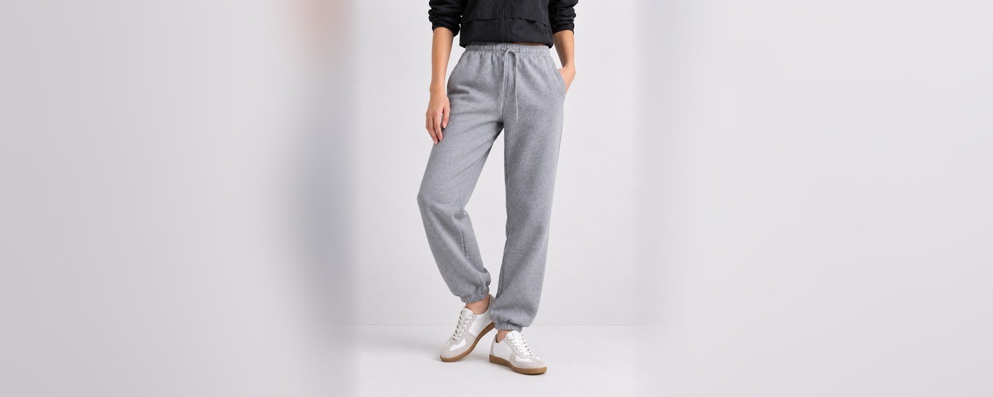 Heather grey jogger sweatpants with drawstring waist, side pockets and cuffed ankles for private label loungewear