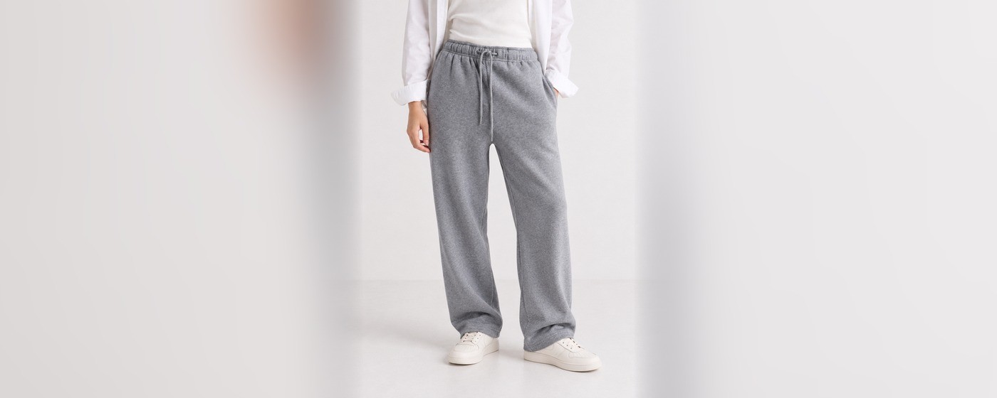 Heather grey straight leg sweatpants with an elasticated drawstring waist and open hem for private label loungewear
