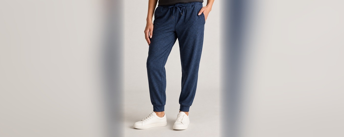 Navy tapered jogger sweatpants with drawstring waist, side pockets and elasticated cuffs for private label loungewear