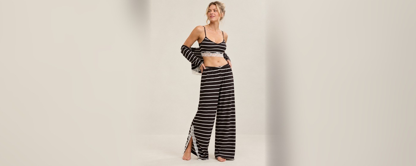 Black and white striped three piece lounge set with a lace-trimmed cami, open cardigan and wide-leg pants for private label loungewear