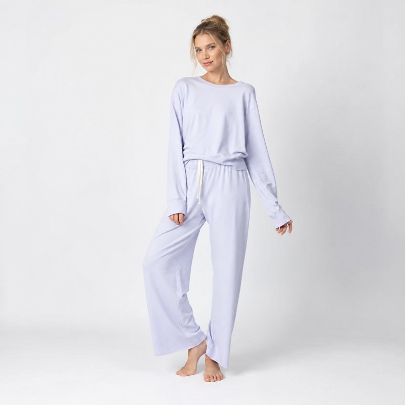 Close view of the round neck and wide-leg pant drape on a soft jersey knit lounge set