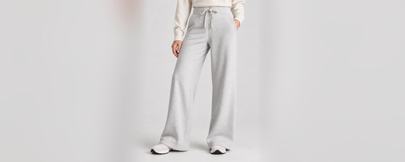 Light grey wide-leg sweatpants with an elasticated drawstring waist and side pockets for private label loungewear