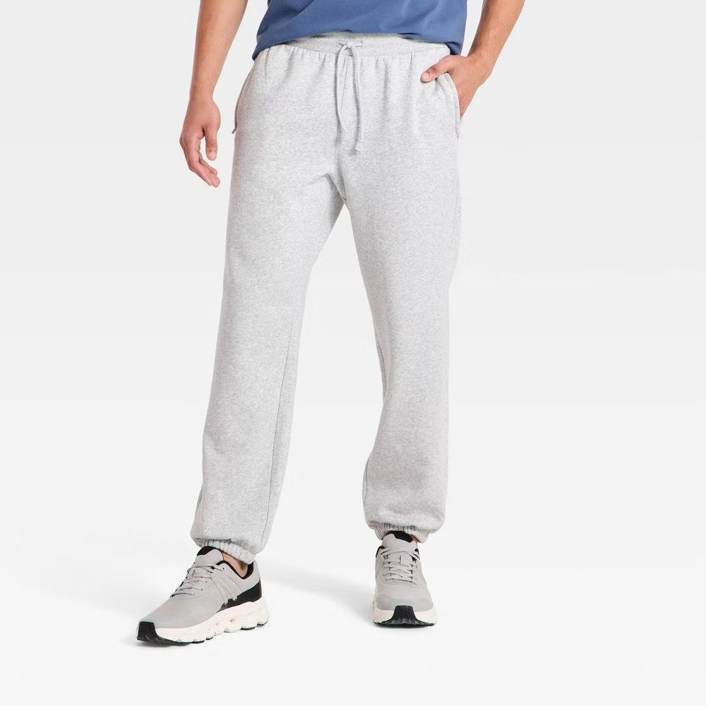 Grey fleece joggers with an elastic drawstring waist and tapered legs