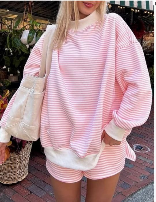 Oversized striped sweatshirt worn with matching shorts as a lounge set