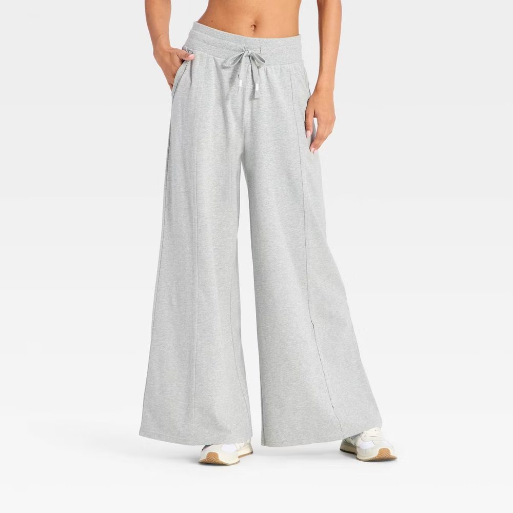 Grey wide-leg lounge pants with a drawstring waist and soft drape
