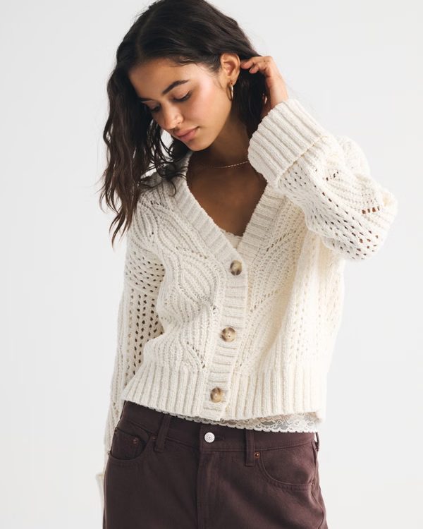 Cream knit cardigan styled as a layering piece for loungewear