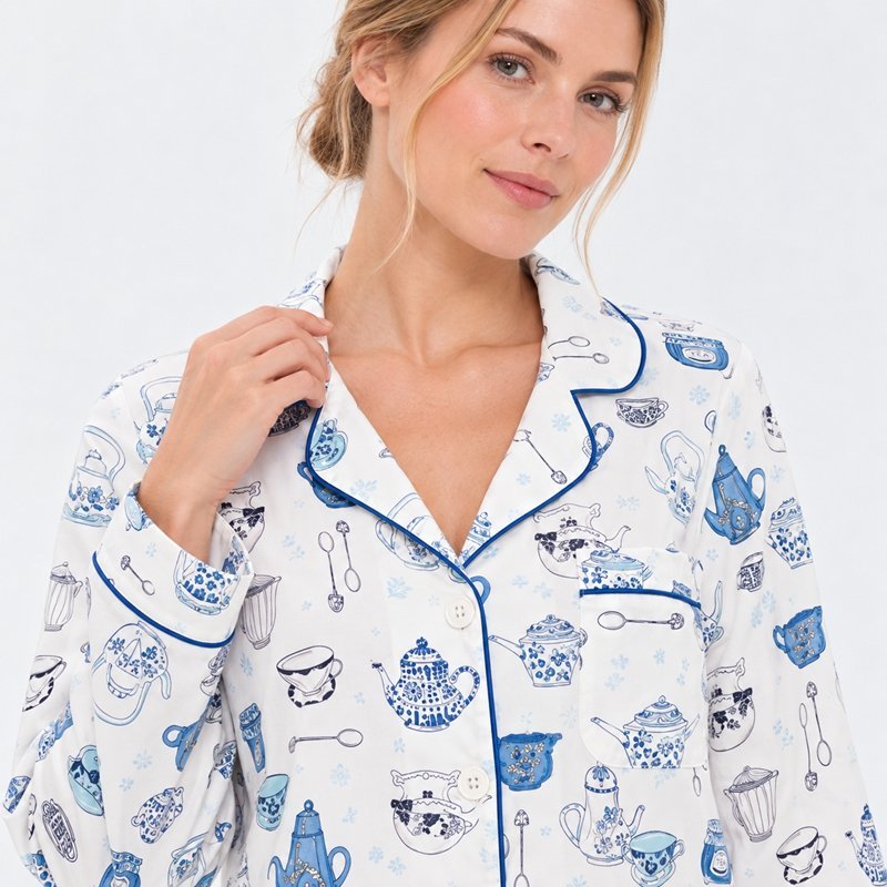 Close view of the navy piping and single ink kitchen motif print on a white pajama set
