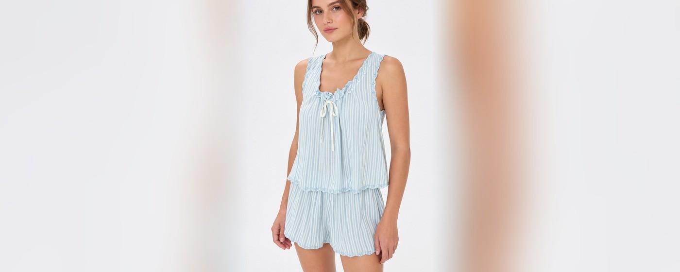 Light blue pinstripe crinkle cami and shorts set with a tie neckline and eyelet hem for private label summer sleepwear