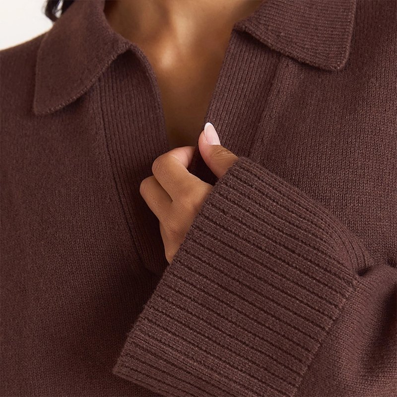 Open polo collar and deep ribbed cuff detail on a chocolate brown chunky knit jumper