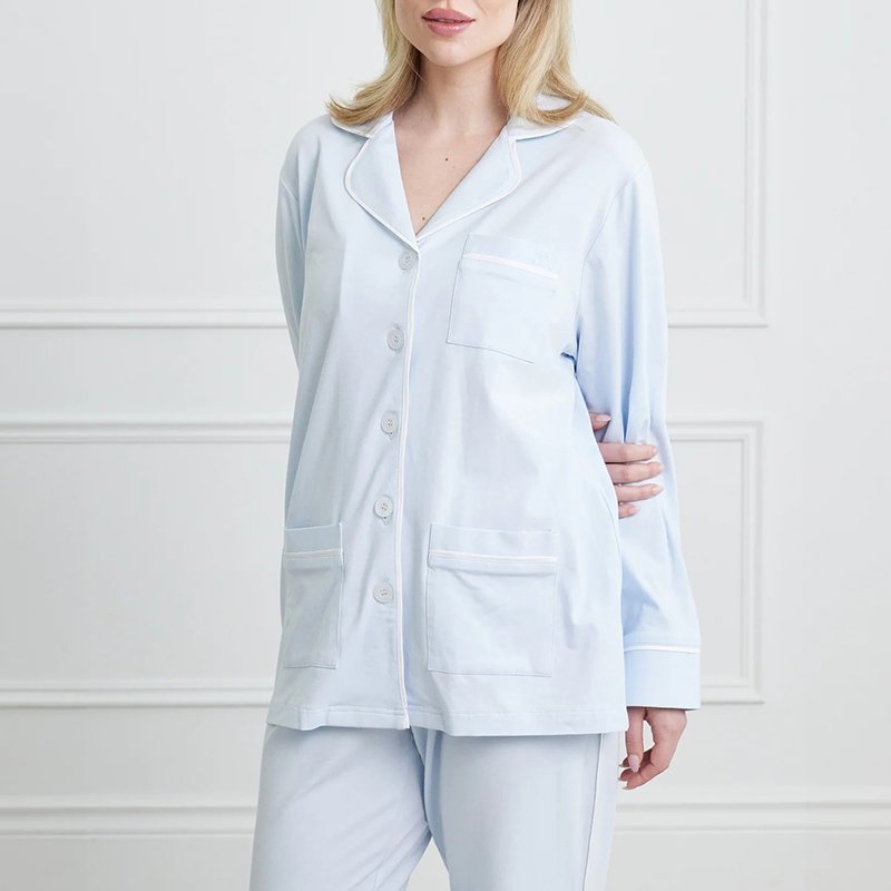 Contrast piping along the placket, cuff and side seam of an ivory stretch cotton pajama set
