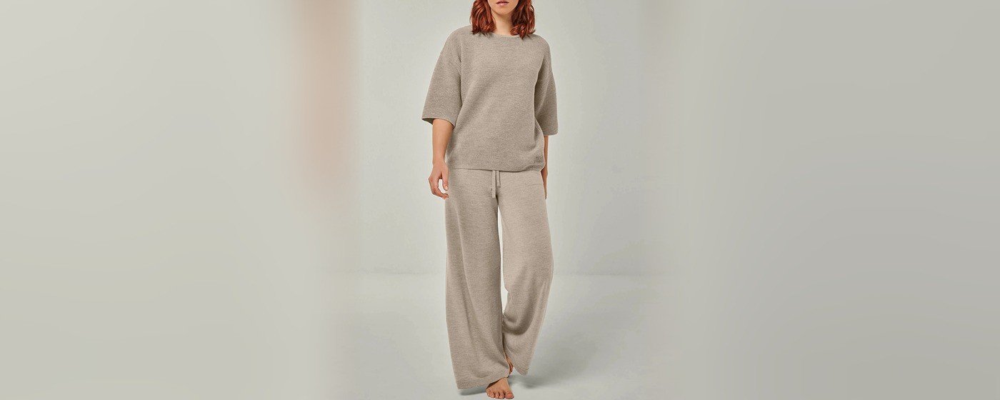 Greige textured knit top with elbow length sleeves and matching wide leg drawstring pants
