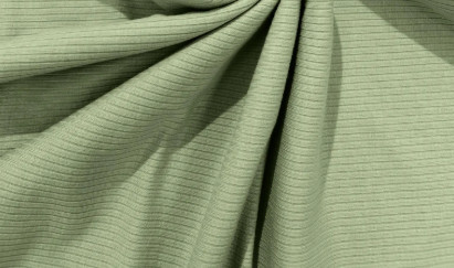 Close-up of sage green rib knit fabric showing fine vertical ribs and soft folds