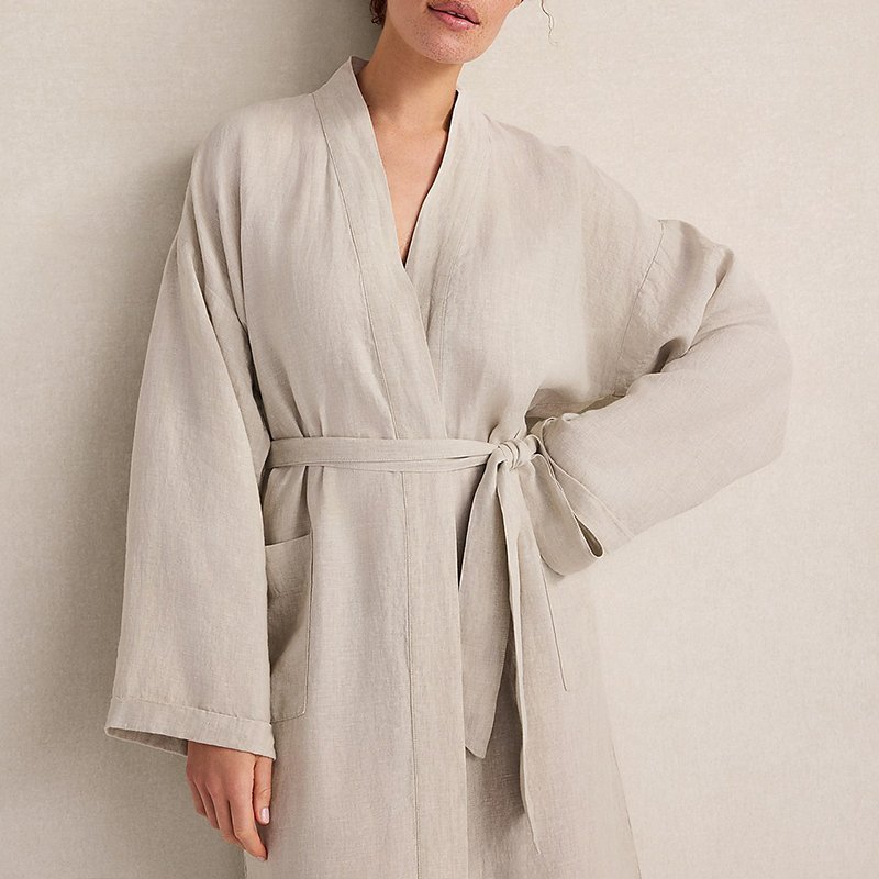 Belt knot and patch pocket detail on an oatmeal washed linen robe