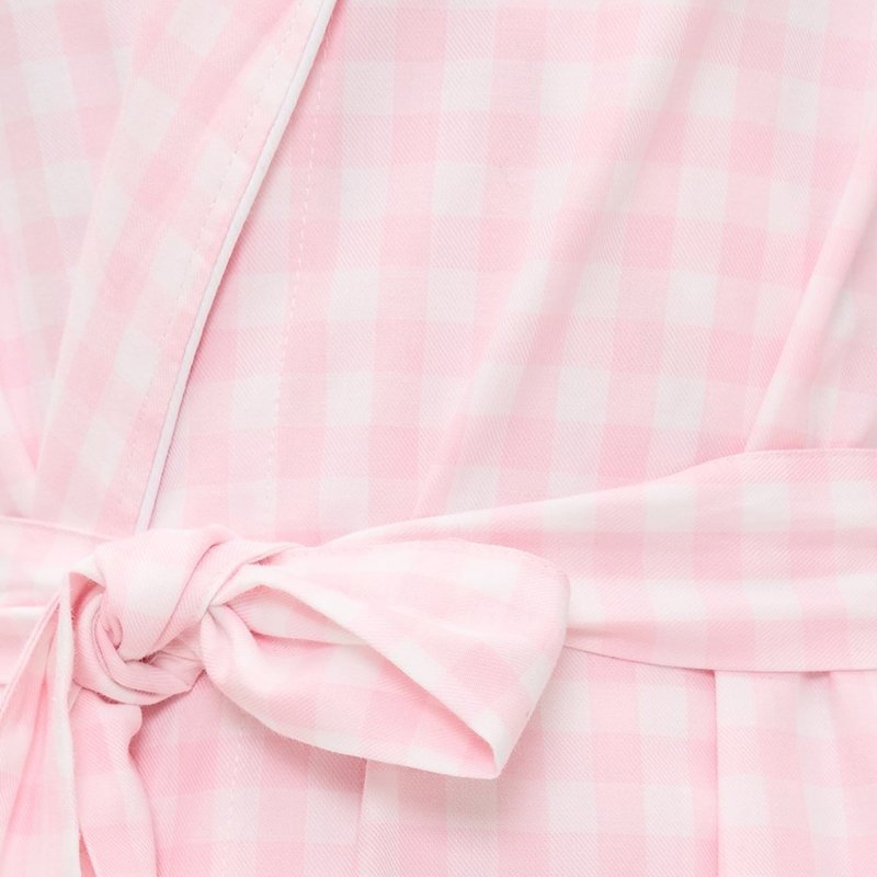 Close-up of gingham check and belt bow on a pink cotton poplin robe