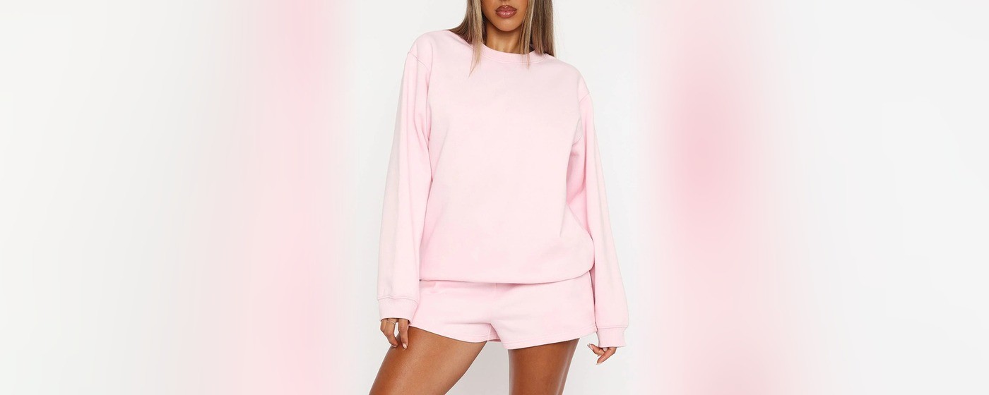 Women's soft pink oversized brushed fleece crewneck sweatshirt with drop shoulders