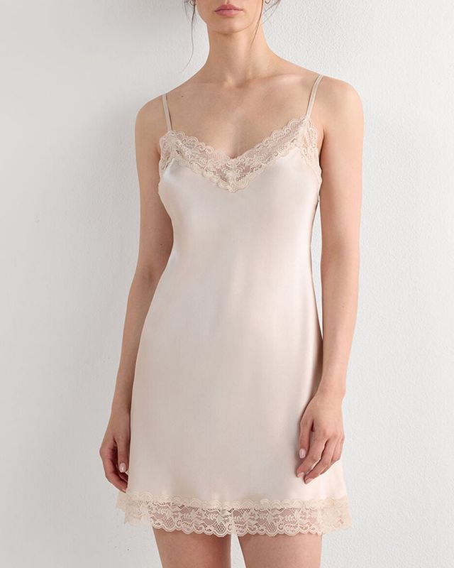 Blush satin slip nightgown with a lace neckline and lace hem